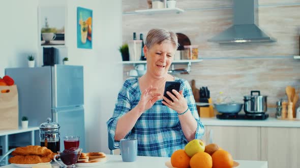 Senior Woman Surfing on Modern Phone