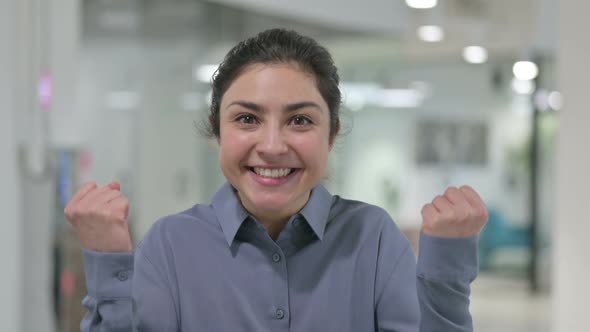 Portrait of Successful Young Indian Woman Celebrating