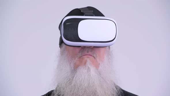 Face of Mature Bearded Hipster Man Using Virtual Reality Headset