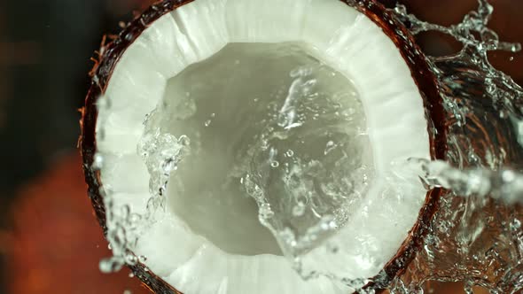 Super Slow Motion Shot of Splashing Water on Coconut at 1000Fps