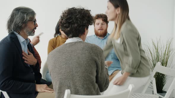 Angry Young Woman Fighting with People at Support Group Session Then Leaving Room