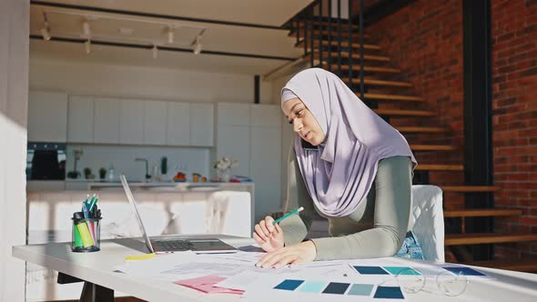 Portrait of Modern Muslim Woman Working Remotely at Home