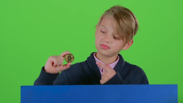 Teenager Gets Up From Behind the Board with the Chip on a Green Screen