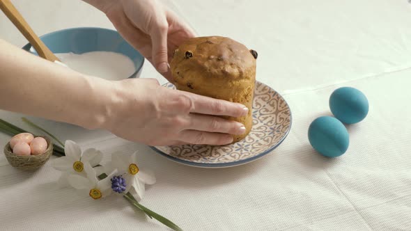 Preparing Easter cakes. Decoration sweet sugar icing sprinkled with colorful be. Happy Easter