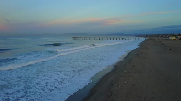 Aerial drone uav view of a pier, beach and ocean.