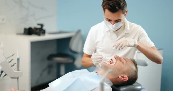 Dentist and Patient During an Orthodontic Treatment