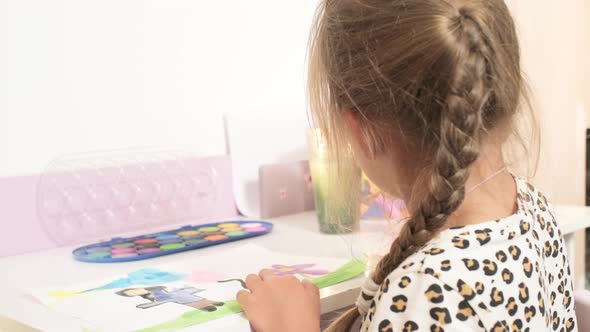 Talented Creative Child Girl Female Artist Draws with Her Hands on Paper Using Fingers Paints Brush