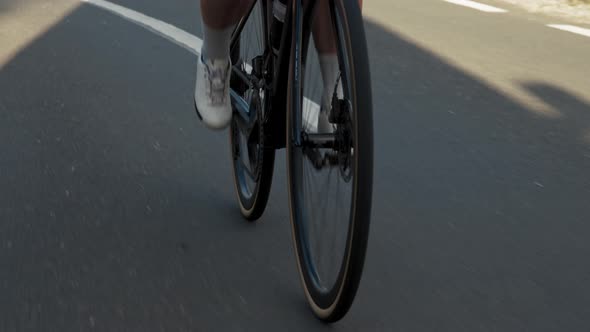 Young Professional Woman Cyclist Tiny Legs Closeup