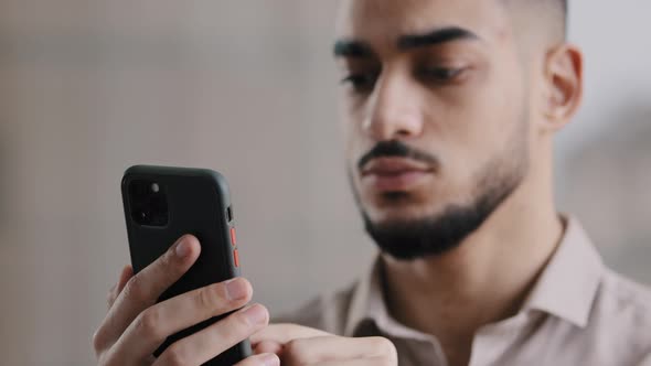 Male Millennial Arabian Man Professional Worker Businessman Holding Smartphone Texting Message at