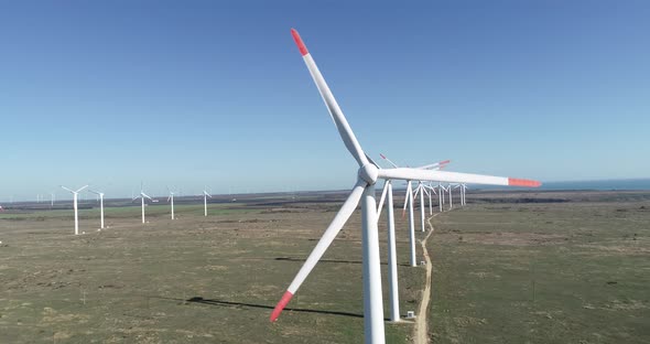 4K aerial view of windmills farm. Modern wind turbines.