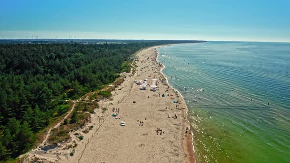 Beach with people in Baltic Sea, aerial view, Poland
