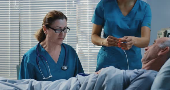 Doctor Using Stethoscope in Hospital