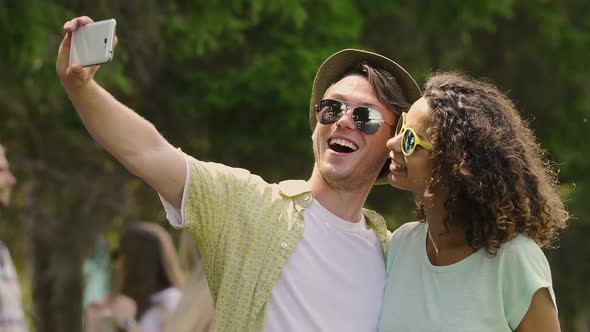 Carefree Young People Enjoying Summer Holidays, Taking Selfie on Smartphone