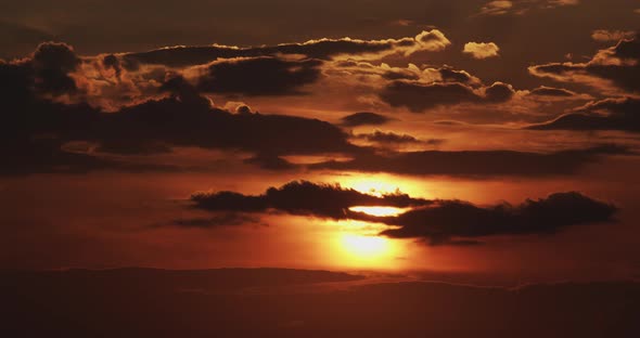 Orange Sunset On A Background Of Clouds. Close Up Timelapse