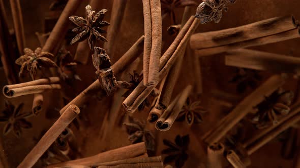Super Slow Motion Shot of Cinnamon Star Anise and Powder Explosion on Black Background at 1000Fps