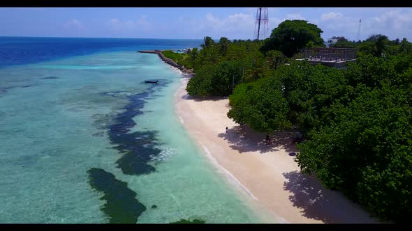 Aerial top down texture of tranquil coastline beach voyage by aqua blue water with white sand backgr