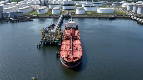 Crude Oil Liquid Cargo Transporter Ship Unloading Petrochemicals to a Fuel Depot