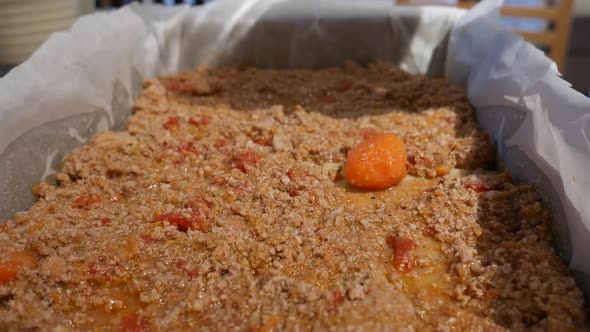 lasagne assembly, adding parmesan cheese to mince meat