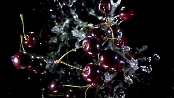 Cherry with Water Rotates in the Air