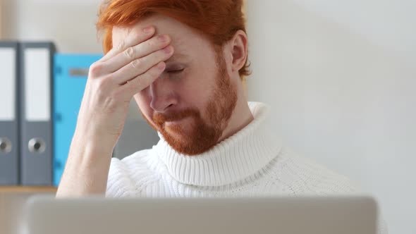 Man with Red Hairs Having Headache at Work, Pain