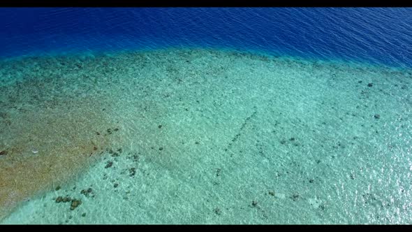 Aerial top down texture of tranquil seashore beach time by blue sea and white sandy background of a 