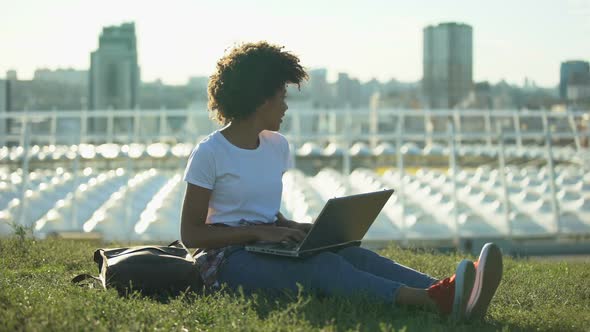 Nice African American Female Student Typing on Laptop Pc Outdoors, Freelance