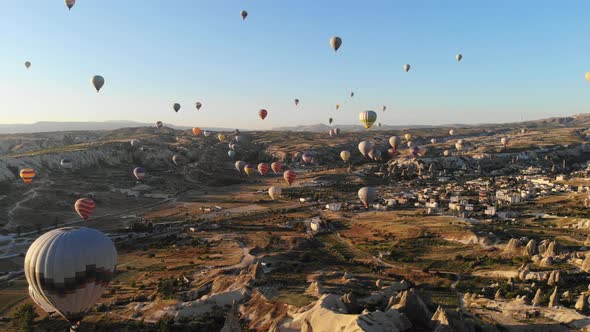 Aerial Hot Air Balloons Flying Over Hoodoos and Fairy Chimneys in Goreme Valley Cappadocia, Turkey
