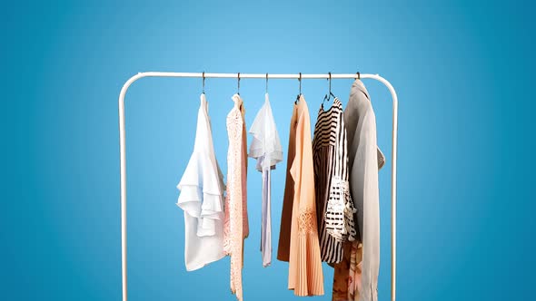 Clothes on a hanger on different colored backgrounds.