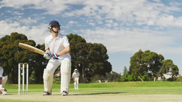 Cricket player shooting in the ball in a pitch