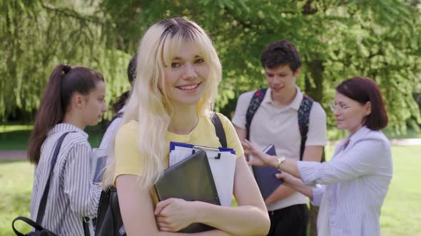 Female Student 16 17 Years Old with Digital Tablet Backpack in School Park