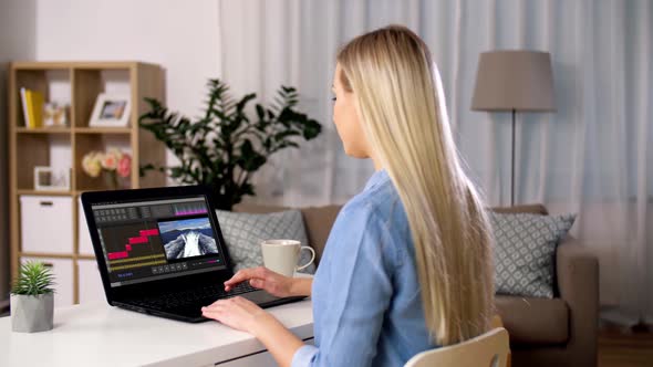 Woman with Video Editor Program on Laptop at Home 26