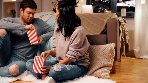 Happy Couple Eating Pop Corn at Home 18