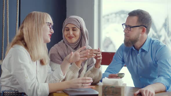 Diverse Group of Friends in a Cafe