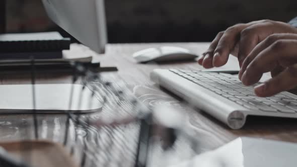 Hands of Businessman Typing on Computer Keyboard