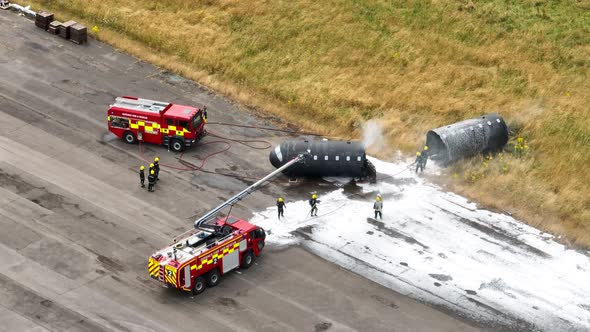 Firefighters Training to Tackle a Fire of a Dummy Aircraft