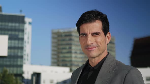 Businessman Posing at Camera on Street. Handsome Executive Standing Outdoors