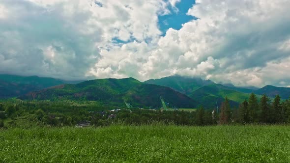 Mount Giewont and ski jump in summer cloudy day, Zakopane, Poland