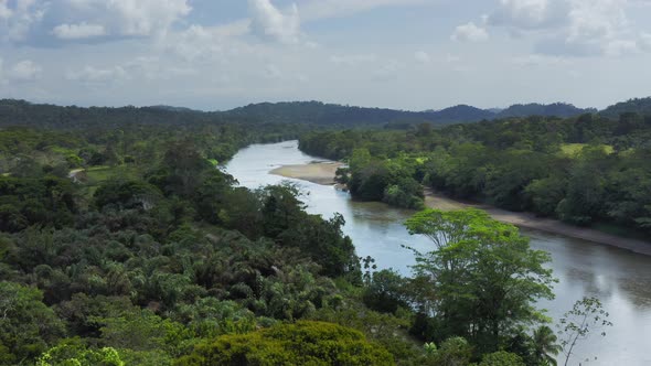 Aerial Drone View of Rainforest River and Mountains Scenery in Costa Rica at Boca Tapada, San Carlos