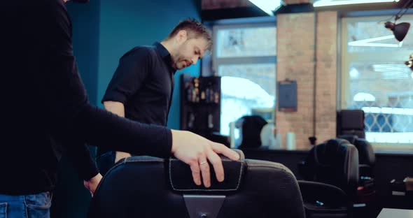 Barber Sits Client in Chair After Washing Hair