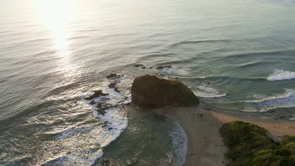 Epic cinematic aerial footage of a popular surfers destination in northern Costa Rica at sunset. Col