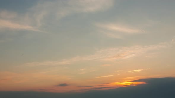 Clouds On Orange Sky During Summer Sunrise, Time Lapse