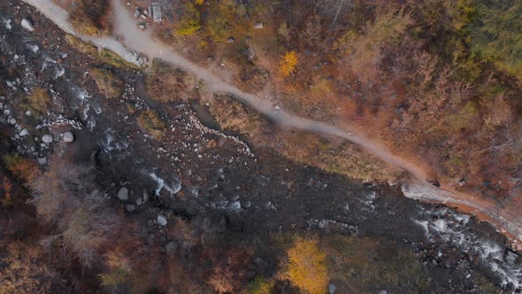 Aerial View of Cyclist Mountain River Landscape of Autumn Forest