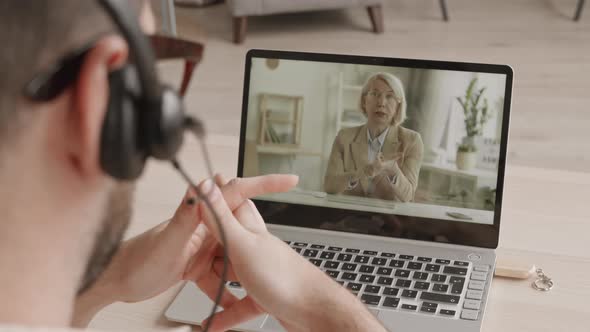 Man on Video Conference with Woman