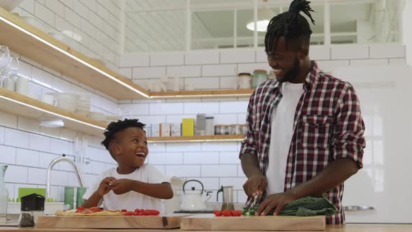 Father and son cooking together