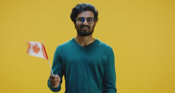 Young Man Waving the Canadian Flag