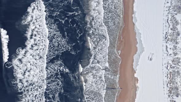 Snowy beach at Baltic sea. Aerial view of wildlife, Poland