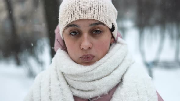 Beautiful Winter Portrait of Young Woman in the Winter Snowy Scenery