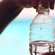 Man Opening a Plastic Bottle of Water - VideoHive Item for Sale
