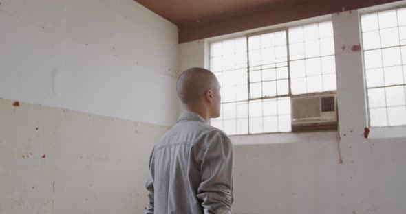 Fashionable young man in an abandoned warehouse