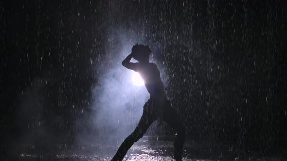 Emotional Performance of Modern Contemporary Choreography. Puffs of Smoke Hiding Young Man Dancer on